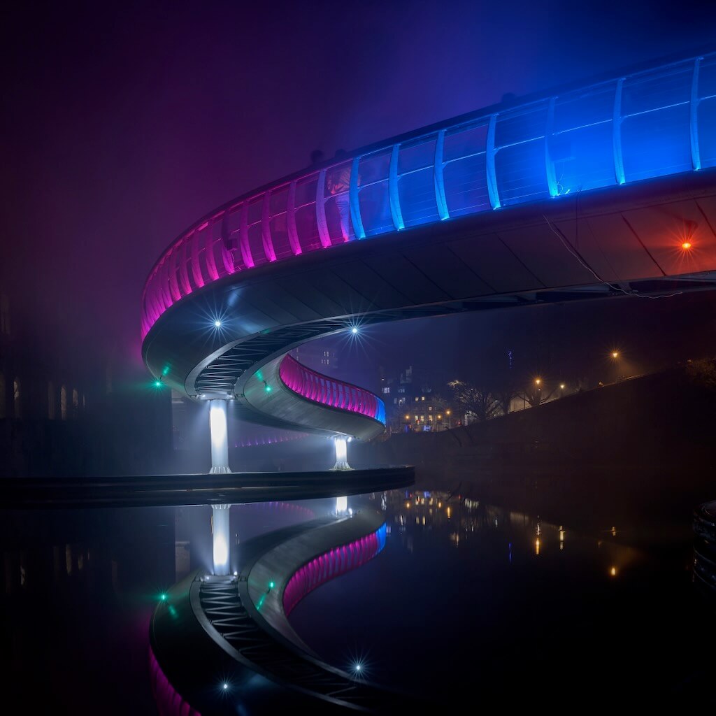 A river view of Tine's illuminate bridge makes it look like a UFO.