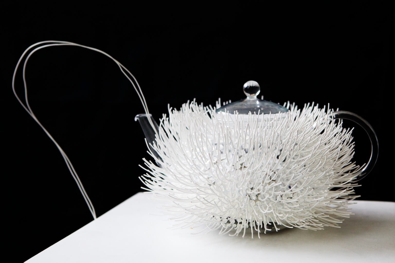 LightPot, the interactive teapot stands out against the darkness even before it starts to glow with light.