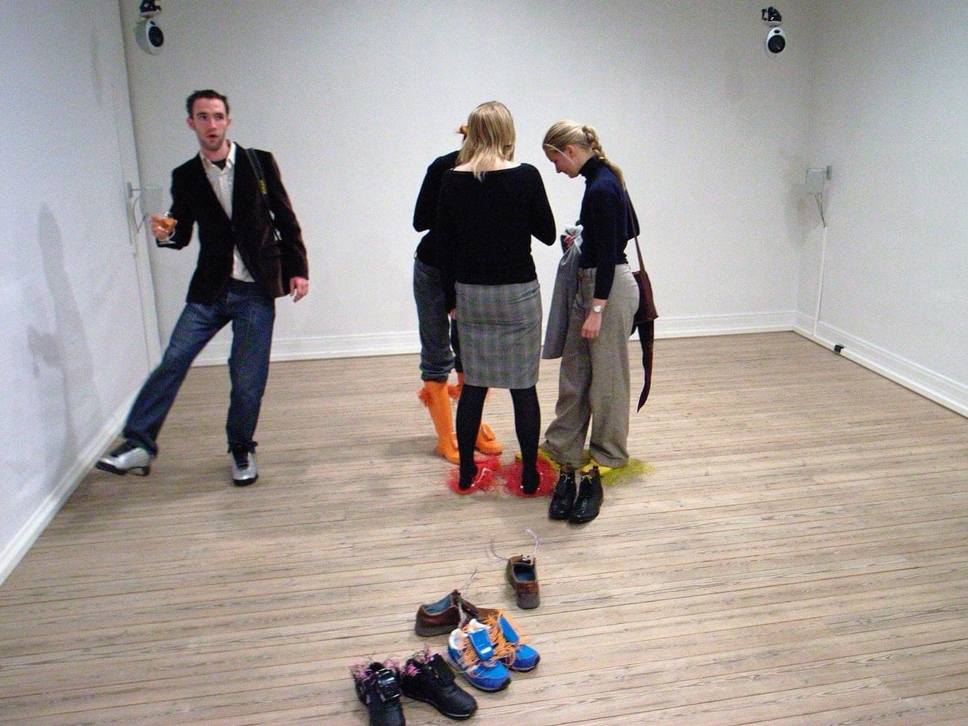 People playfully interact with noise creating shoes.