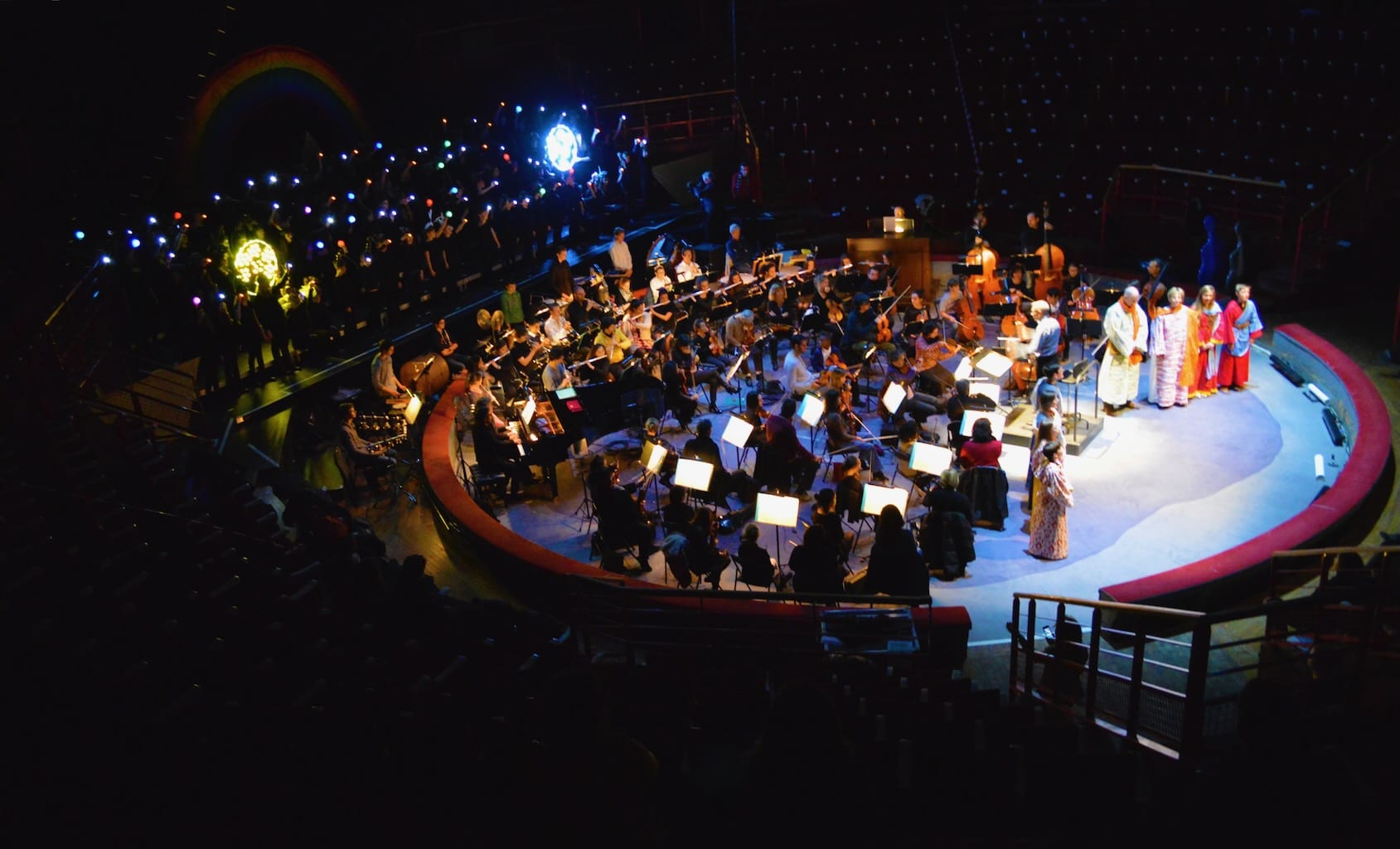 The stage for Noye's Fludde is alive with musicians, actors and light painters.