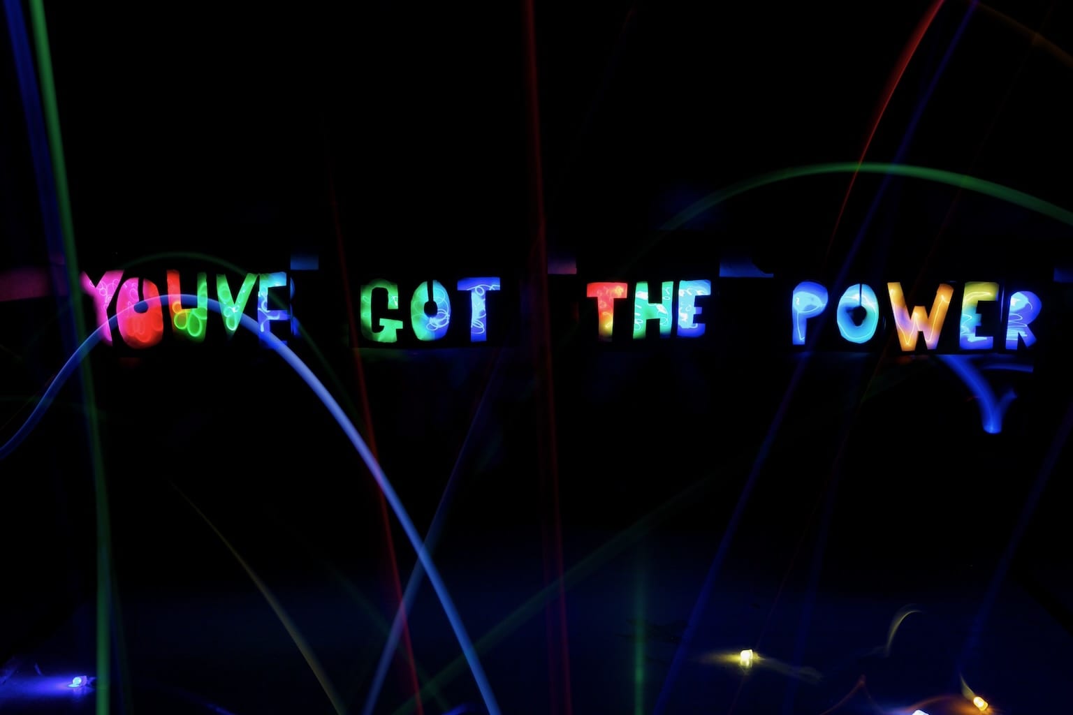 Created by light trails, an inspirational message appears out of darkness to read 'You've got the power'.