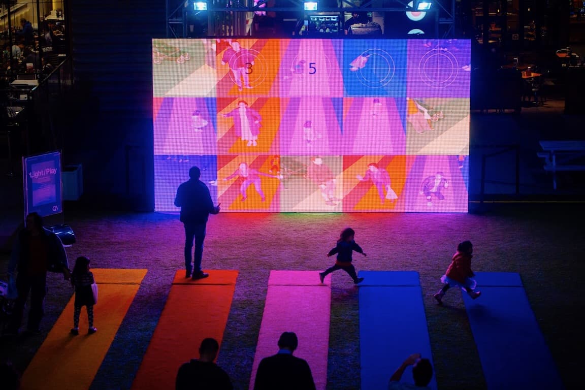Children and adults alike playfully interact with Tine's work.