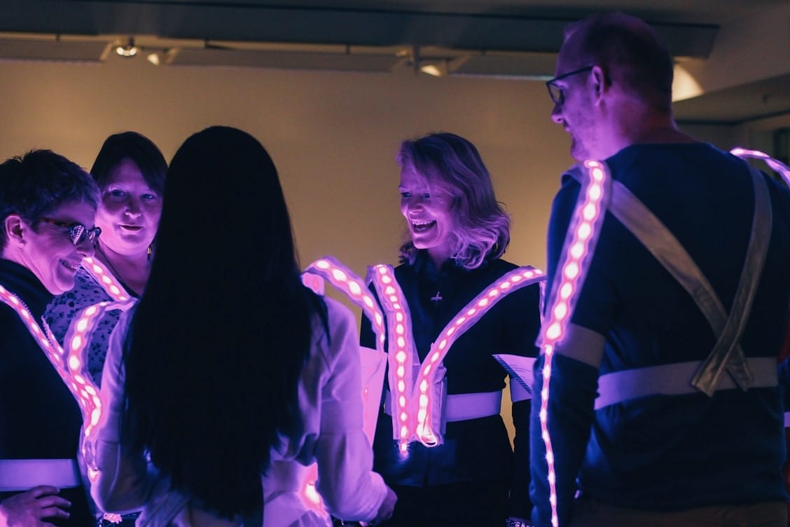 Happy faces show the joy of Tine's interactive light art game.