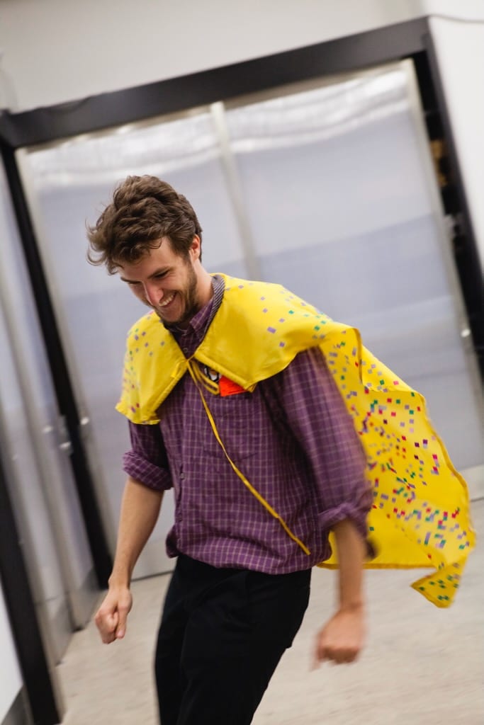 Movement and sound created in Tine's workshop Tracking You brings great joy to a man participating in a yellow cape.