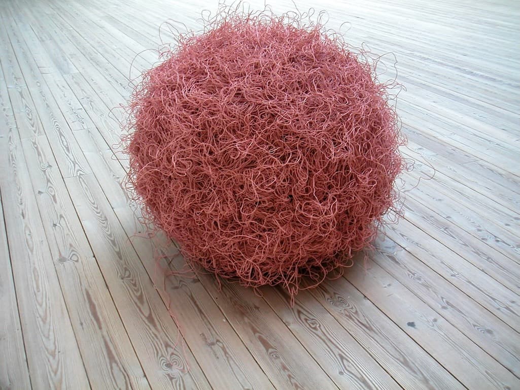 A huge ball of pink twisted wire.