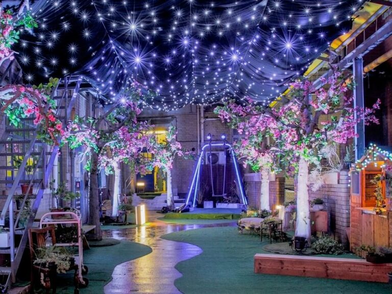 Under a canopy of star-like lights, an artificial secret garden invites visitors to play.