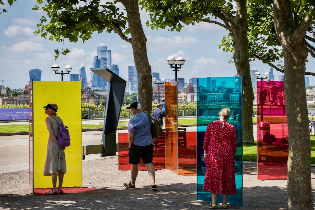 Passers-by marvel at Colour Connections with the London city skyline in the distance.