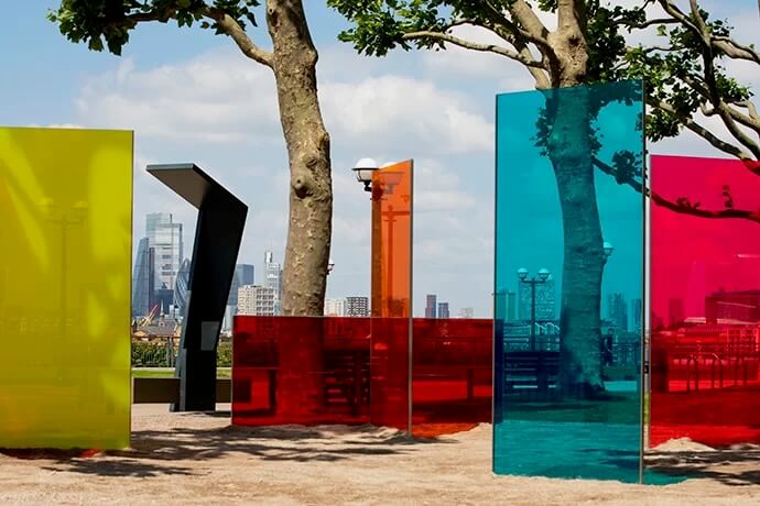 Large panes of glass are coloured in vibrant hues of blue, pink, orange, yellow, and red.
